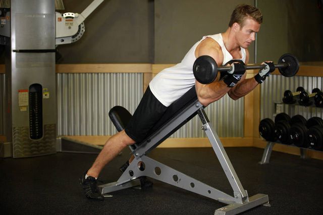 Barbell Curls Lying Against An Incline: finishing position