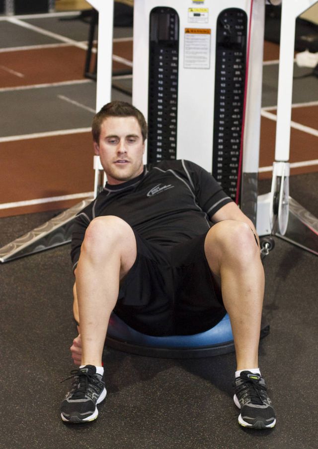 Bosu Ball Cable Crunch With Side Bends: finishing position
