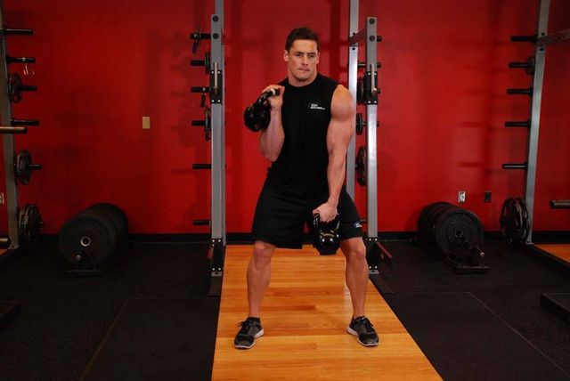 Double Kettlebell Alternating Hang Clean: finishing position