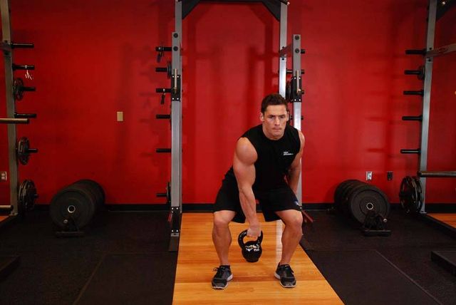 One-Arm Kettlebell Split Snatch: finishing position