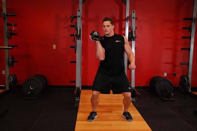 One-Arm Open Palm Kettlebell Clean: finishing position