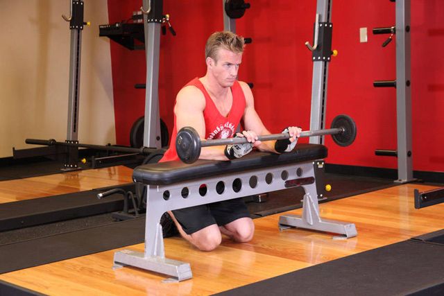 Palms-Down Wrist Curl Over A Bench: finishing position