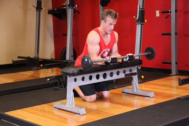 Palms-Up Barbell Wrist Curl Over A Bench: finishing position