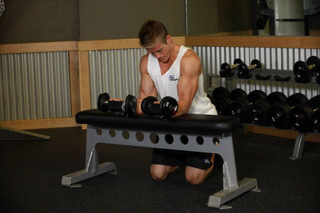 Palms-Up Dumbbell Wrist Curl Over A Bench: finishing position