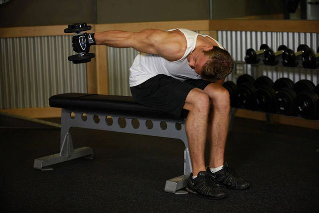 Seated Bent-Over One-Arm Dumbbell Triceps Extension: finishing position