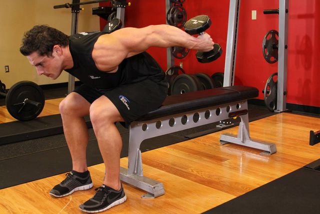 Seated Bent-Over Two-Arm Dumbbell Triceps Extension: finishing position