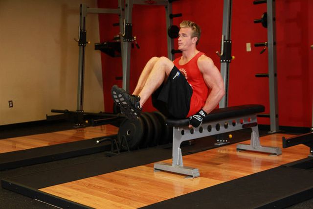 Seated Flat Bench Leg Pull-In: finishing position