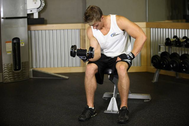 Seated One-Arm Dumbbell Palms-Up Wrist Curl: finishing position