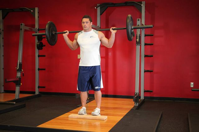 Standing Barbell Calf Raise: finishing position