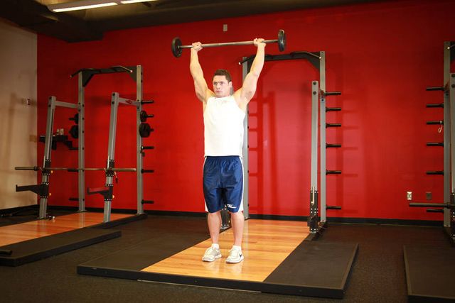 Standing Barbell Press Behind Neck: finishing position