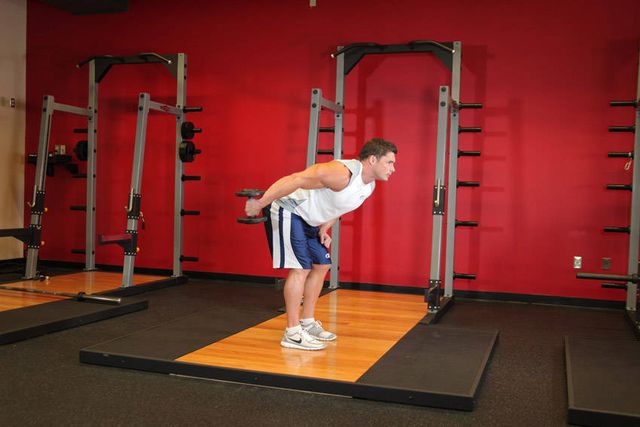 Standing Bent-Over One-Arm Dumbbell Triceps Extension: finishing position