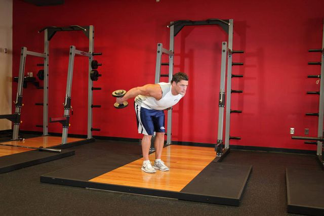 Standing Bent-Over Two-Arm Dumbbell Triceps Extension: finishing position