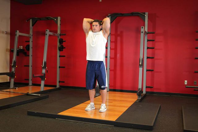 Standing Dumbbell Triceps Extension: finishing position