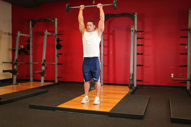 Standing Front Barbell Raise Over Head: finishing position