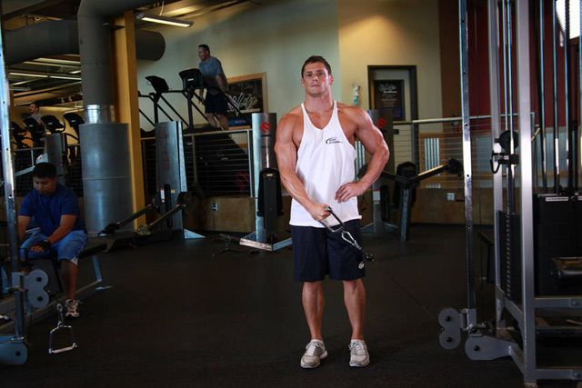 Standing Low-Pulley Deltoid Raise: finishing position