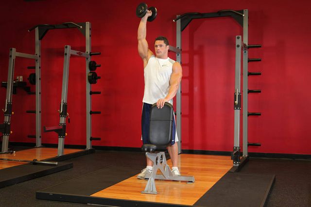 Standing Palm-In One-Arm Dumbbell Press: finishing position