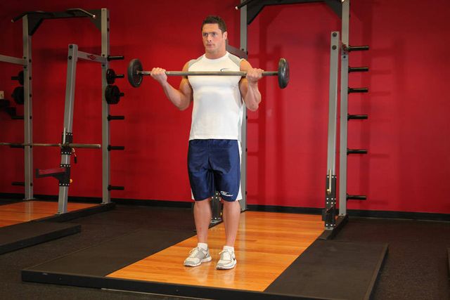 Wide-Grip Standing Barbell Curl: finishing position