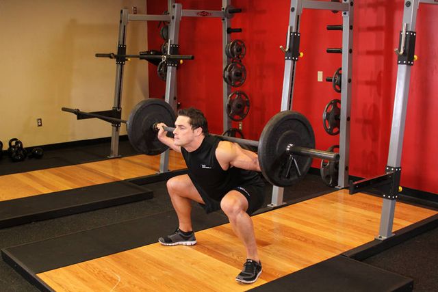 Wide Stance Barbell Squat: finishing position